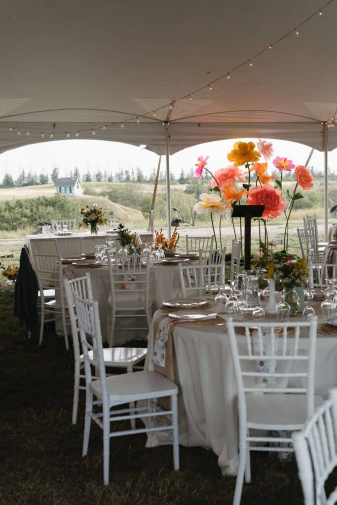 The tent reception at Blue Sky Ranch, tables set with flowers and lights