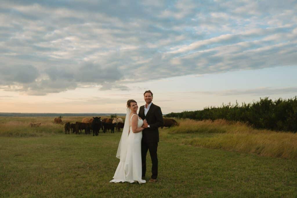 A newly married couple in the river hills at Blue Sky Ranch
