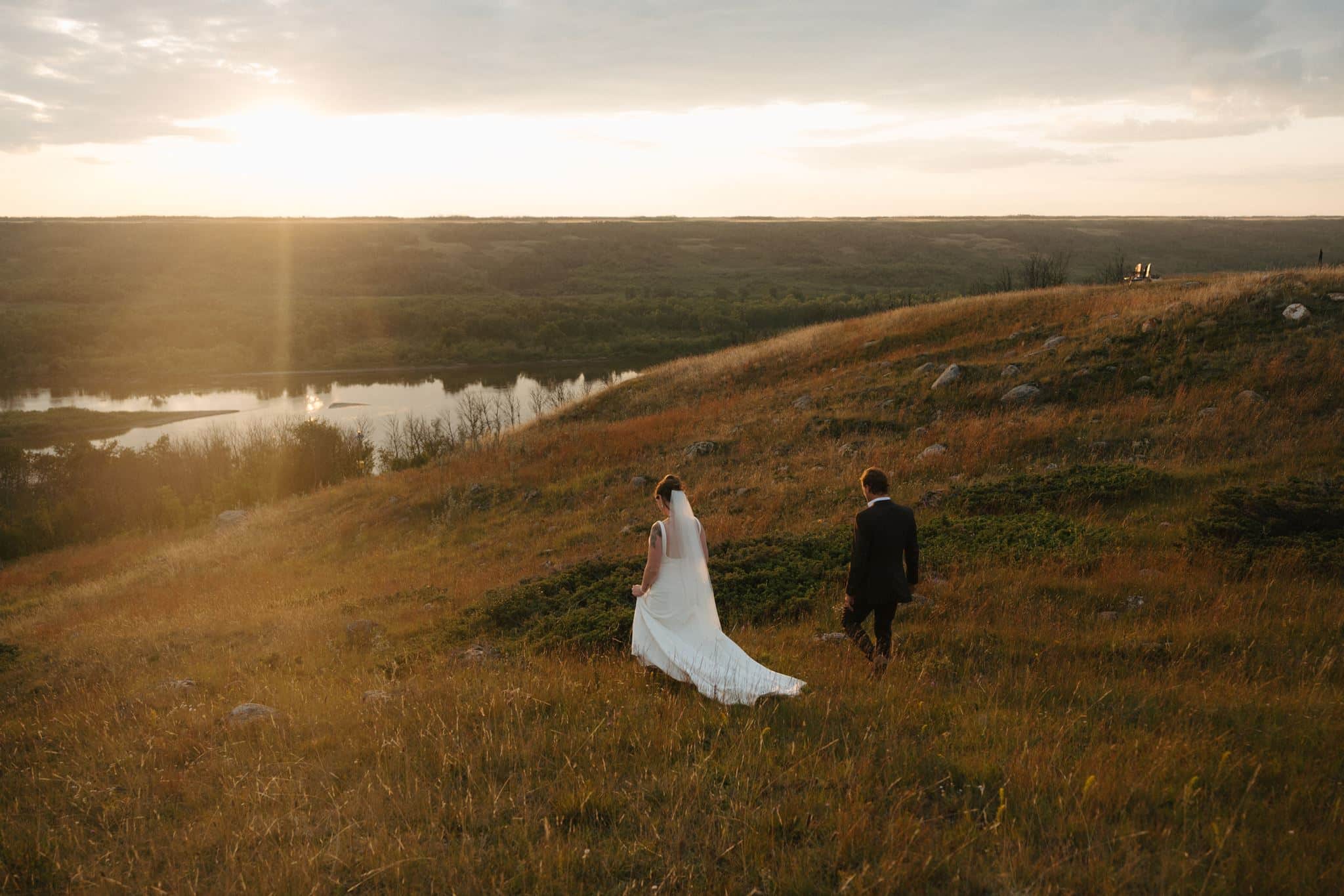 A newly married couple in the river hills at Blue Sky Ranch