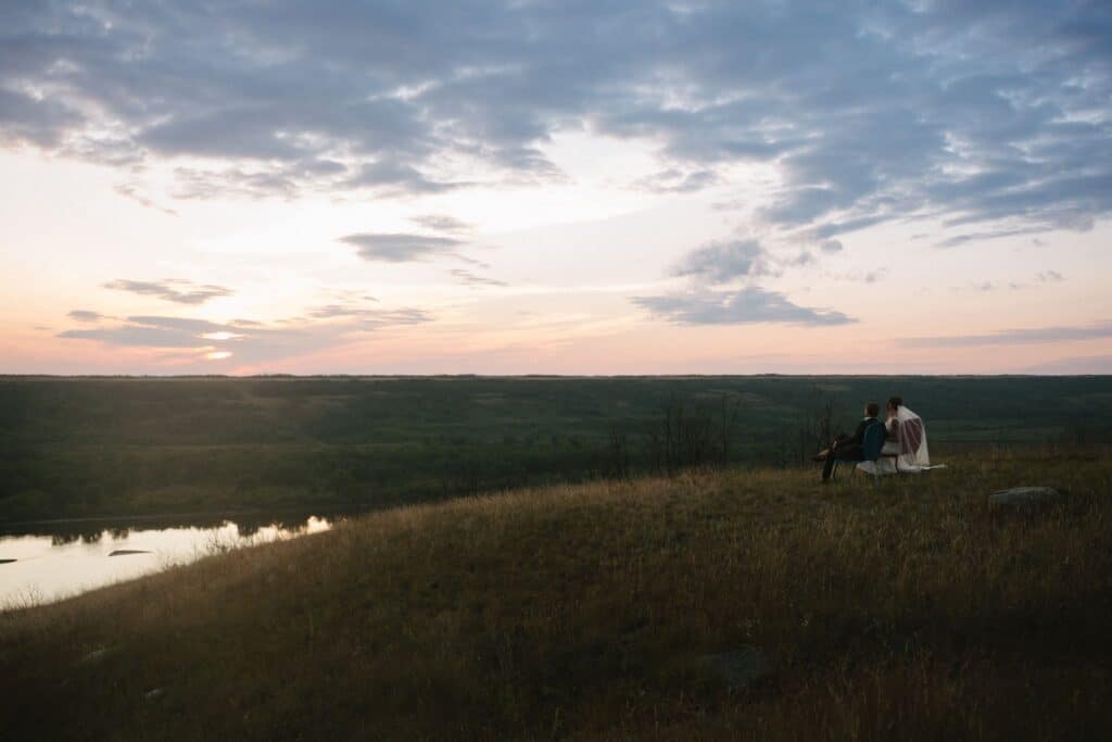 A newly married couple in the river hills at Blue Sky Ranch