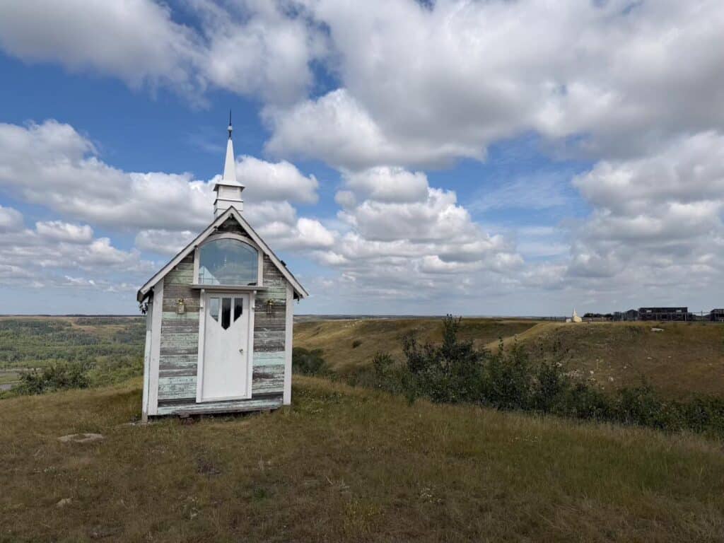 A small white country church near trees