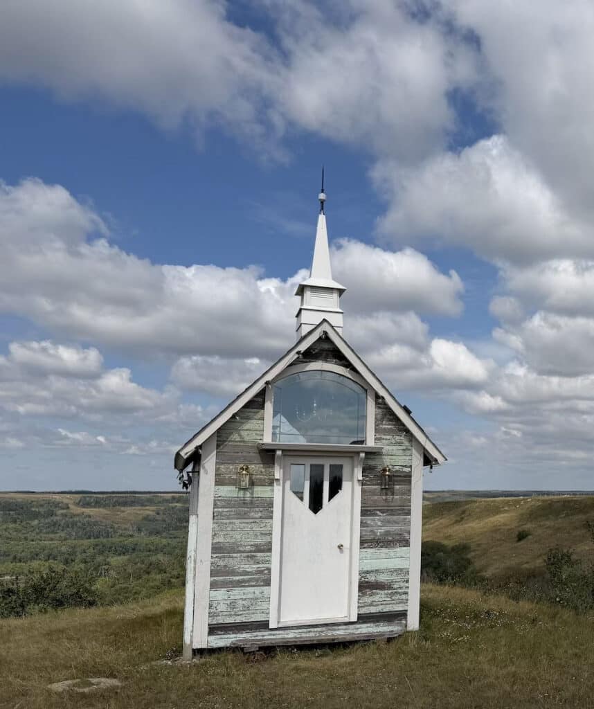 The small wooden chapel with its steeple at Blue Sky Ranch, a Saskatchewan wedding venue