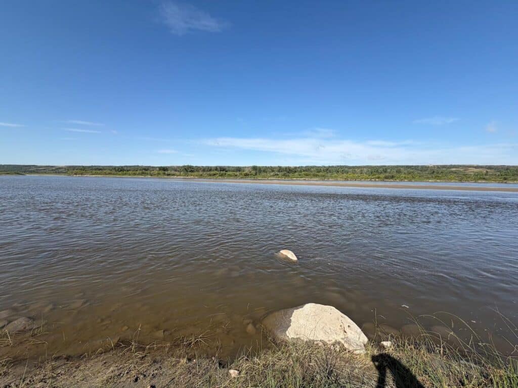 A canoe resting on a river sandbar