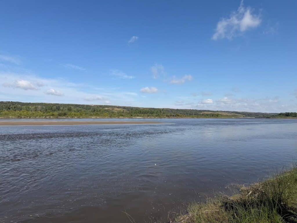A canoe resting on a river sandbar
