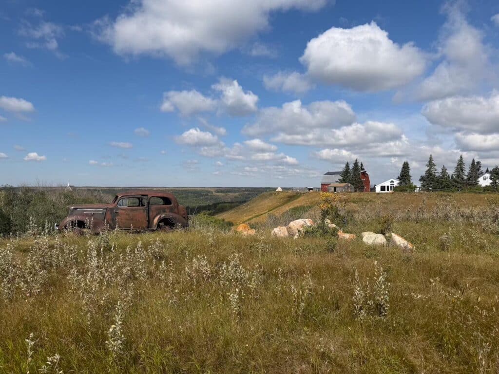 A walking trail through rolling grass hills
